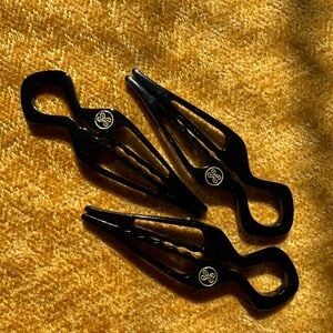 Elegant Black Hair Clips with Gold Emblem